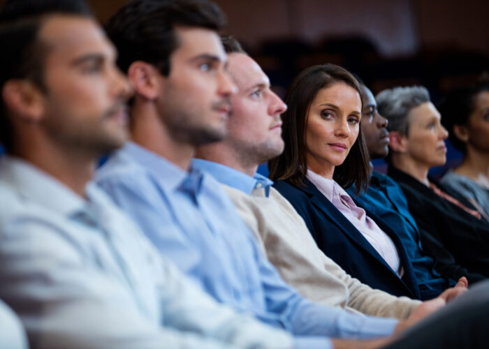 Business executives participating in a business meeting at conference center